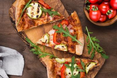 Delicious Pizza Slices on Wooden Board – Free Download