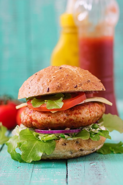 Juicy Chicken Burger Sandwich with Cheese and Tomato – Free Download