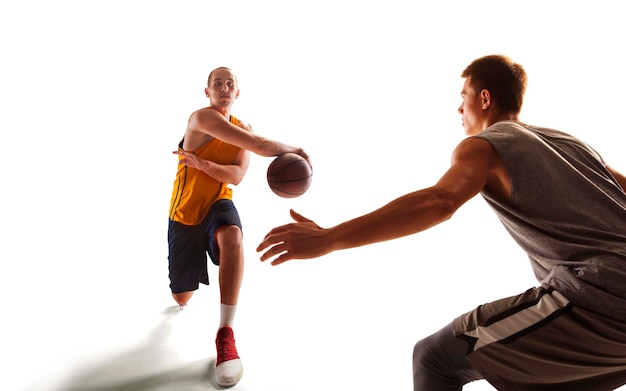 Dynamic Basketball Player in Action During Sunset – Free Download