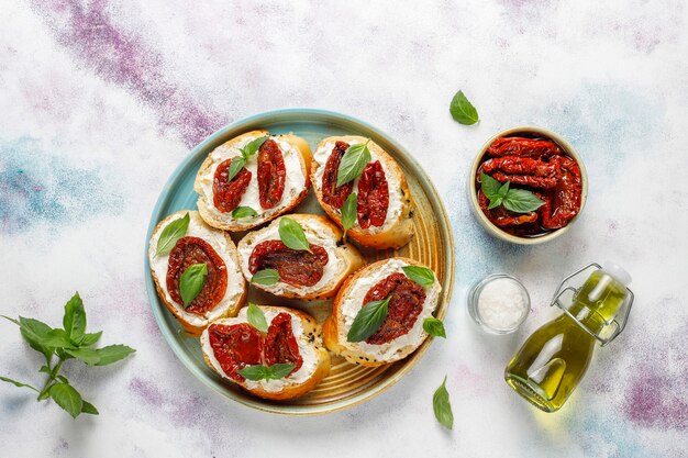 Bruschetta with Cheese, Dried Tomatoes, and Basil – Free Download, Free Stock Photo