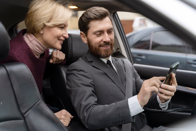 Taxi Driver and Female Client Interaction – Free Stock Photo for Download