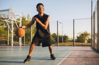 Young Happy Man Playing Basketball at Sunrise with Headphones – Free to Download