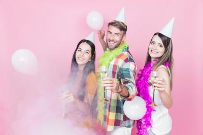 Three Friends Celebrating with Champagne Flutes at a Party – Free Download