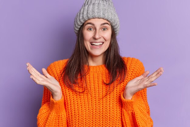 Happy Smiling Woman in Orange Winter Jumper and Hat – Free Stock Photo for Download