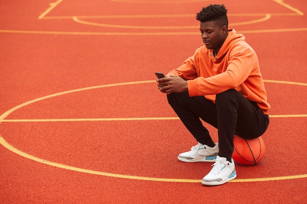 Teenager Posing at the Basketball Field – Free Download