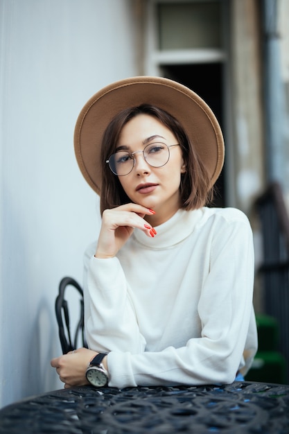 Pretty Woman in Street Fashion with Red Manicure and Transparent Glasses – Free Stock Photo