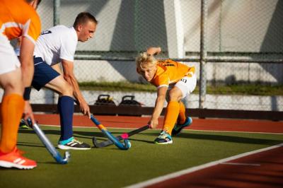 Field Hockey Players Competing in a Tournament Game – Free Download