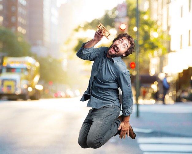 Crazy Young Man Jumping with a Happy Expression – Free Stock Photo, Download for Free