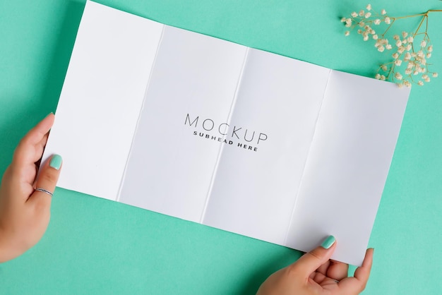 Mockup Brochure Held by Female Hands – Free Download