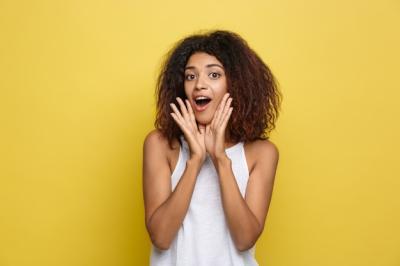 Beautiful African American Woman with Trendy Glasses on Yellow Background – Free Stock Photo for Download