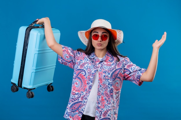 Young Woman Traveler with Suitcase and Red Sunglasses â Free Download