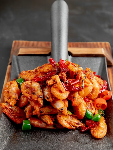 Fried Shrimps with Red and Green Peppers on a Wooden Cutting Board – Free Download