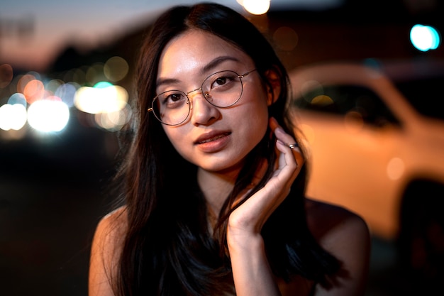 Beautiful Woman Portrait at Night with City Lights – Free Download