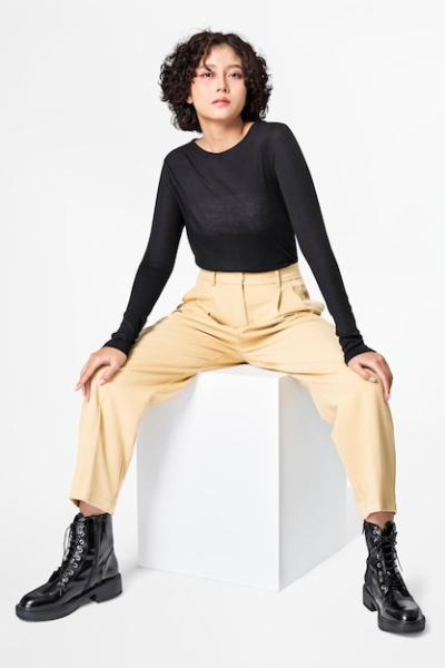 Stylish Woman in Black Long Sleeve Tee and Beige Slacks – Free Download