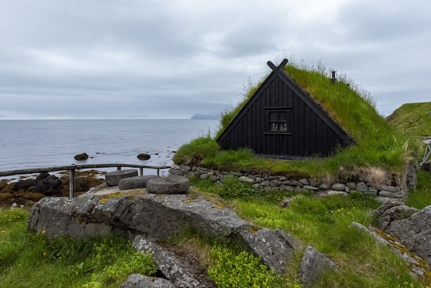 Typical Icelandic Fishing Village Featuring Grass-Roofed Homes and Fish Drying Racks – Free Download