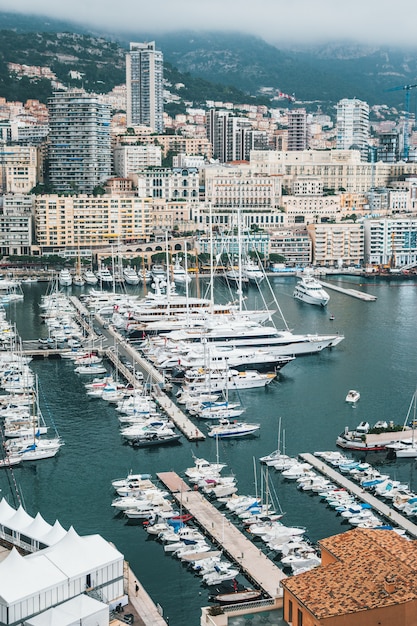 Beautiful Aerial Shot of a Dock with Urban City Background – Free Download