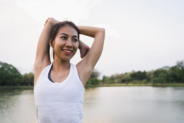 Healthy Young Asian Runner Woman Stretching Before Exercise and Yoga – Free Download