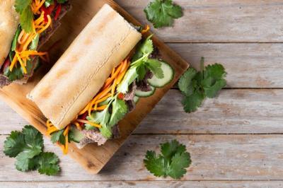 Delicious Vietnamese Banh Mi Sandwich on Wooden Table – Free Download