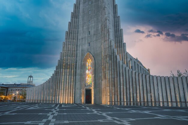 Hallgrimskirkja Church in Reykjavik Against a Dramatic Sky and Geometric Plaza – Free Download