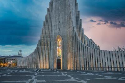 Hallgrimskirkja Church in Reykjavik Against a Dramatic Sky and Geometric Plaza – Free Download