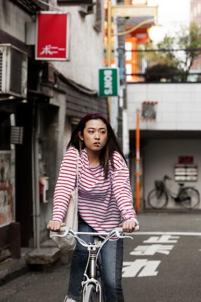 Young Woman Walking Through the Neighborhood – Free to Download