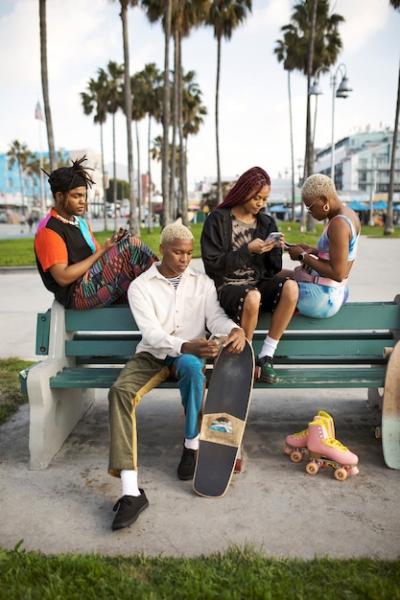 Friends Enjoying Time in the Park with Smartphones – Free Stock Photo for Download