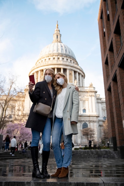 Tourists Enjoying the City While Wearing Travel Masks – Free Stock Photo for Download