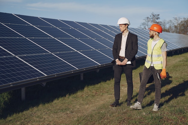 Foreman and Businessman at a Solar Energy Station – Free Download