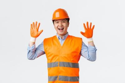 Cheerful Smiling Asian Builder and Construction Manager in the Building Sector – Free Download