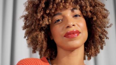 Mixed Race Black Woman with Curly Hair and Natural Makeup – Free Stock Photo for Download