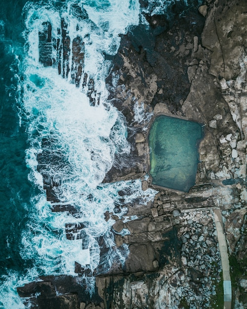 Stunning Aerial View of Rocky Coast and Ocean Waves – Free Stock Photo for Download