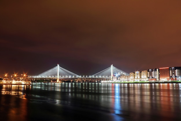 Stunning Night Views of a Cable-Stayed Bridge Illuminated by Colorful Lights – Free Download