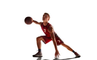 Basketball Player in Action Against a Stunning Sunset – Free Download