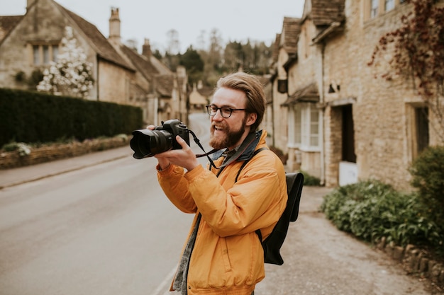 Photographer Capturing Scenic Moments in Cotswolds Village – Free Download