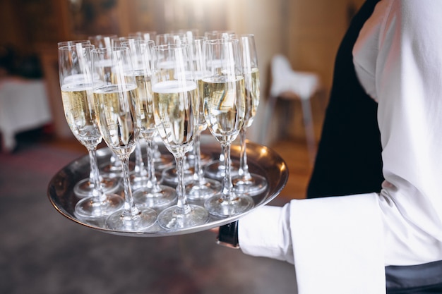 Waiter Serving Beverage on a Tray in a Restaurant – Free Download