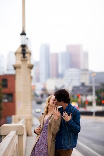 Happy Couple Posing Outdoors in the City with Engagement Ring – Free Stock Photo, Download Free Stock Photo