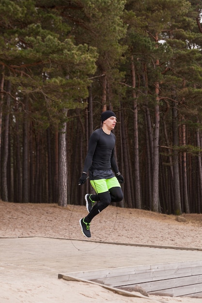 Man Jumping Over a Skipping Rope – Free Stock Photo, Download for Free