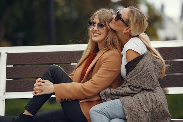 Girls Enjoying Coffee in a Spring City Scene – Free Download