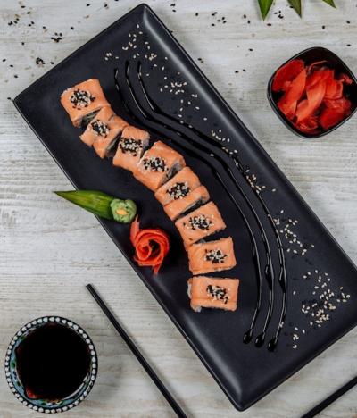 Delicious Top View of Salmon Sushi Roll with Ginger, Wasabi, and Soy Sauce – Free Download