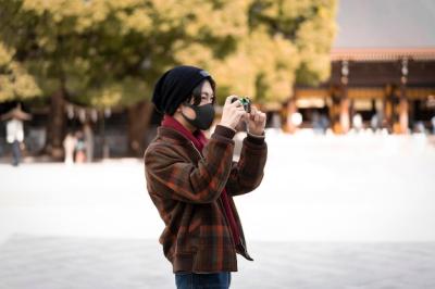 Man Taking Pictures Outdoors in a Face Mask – Free Stock Photo for Download