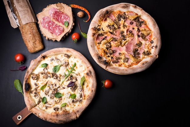 Mushroom and Salami Pizza with Ingredients on Black Surface – Free Download