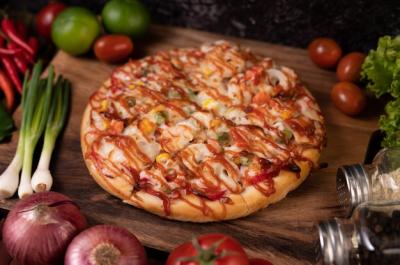 Delicious Pizza Loaded with Sausage, Corn, Beans, Shrimp, and Bacon – Free Download