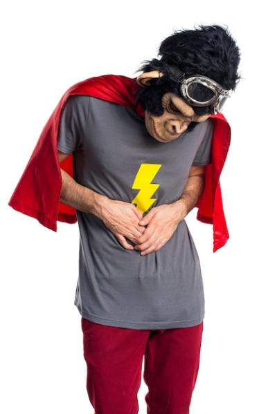 Superhero Monkey Man Experiencing Stomachache – Free Stock Photo for Download