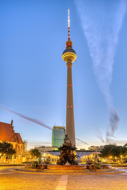 The Iconic Berliner Fernsehturm and Neptune Fountain at Sunrise – Free Download