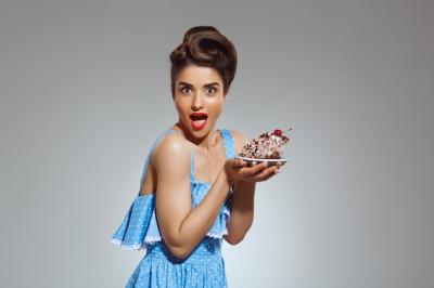 Portrait of Beautiful Pin-Up Woman Holding Cake – Free Download