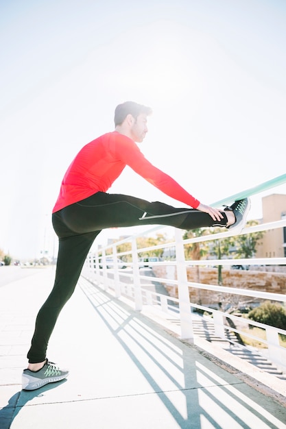 Sportsman Exercising Near Fence – Free Stock Photo for Download