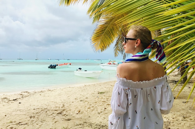 Stunning Woman in White Shirt Under Palm Trees – Free Stock Photo, Download for Free