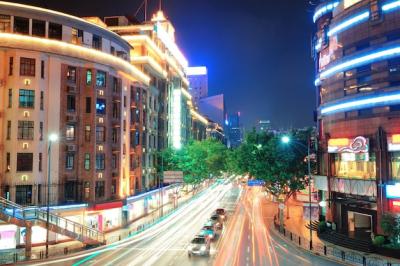 Shanghai Street View: Urban Scene and Busy Traffic at Dusk – Free Download