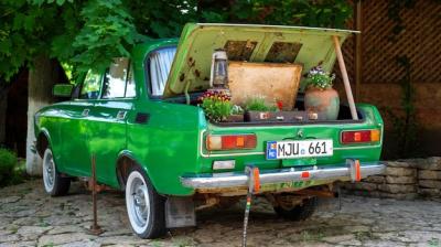 Vintage Green Car Trunk Decorated with Flowers – Free Download