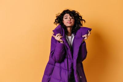 Lovable Young Woman in Purple Down Jacket – Free Stock Photo for Download